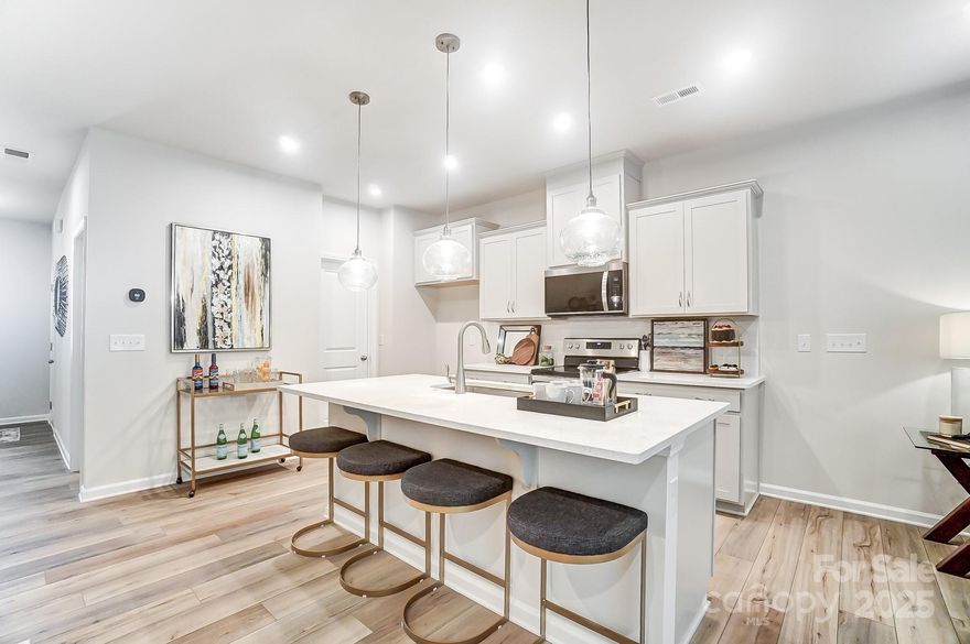 Welcome to The Adriana, a beautifully designed townhome that blends modern convenience with timeless charm.  This thoughtfully crafted home features a one car garage and a welcoming front porch, leading into a stylish foyer.  The first floor boasts a convenient powder room, and well appointed kitchen with a breakfast area, a spacious island, and an open-concept gathering room, perfect for entertaining.  Step outside to enjoy the private patio, ideal for outdoor relaxation.

Upstairs, the owner's suite offers a peaceful retreat, complete with a walk-in closet and a spa-like en-suite bath, featuring a large shower with a built-in seat.  A versatile loft provides additional living space, while the laundry room adds everyday convenience.  Two additional bedrooms, a full bathroom, and a hall linen closet complete the upper level.

With its smart layout and stylish finishes, The Adriana is designed for comfort and effortless living.  Schedule your showing today!