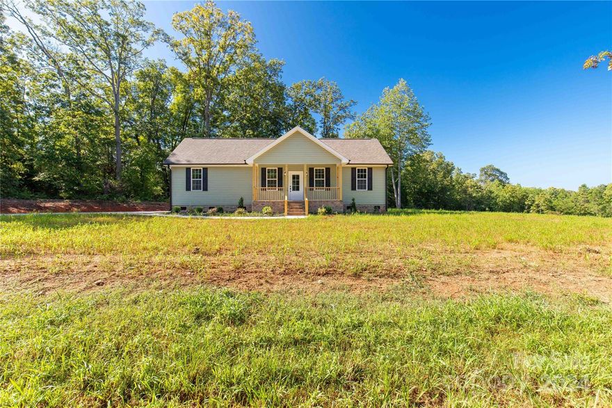 Welcome to 411 McKnight Road, Smyrna, SC! This charming new construction home is as delightful as they come, ready for you to make it your own. Situated on a spacious 2.4-acre lot, this property boasts the finest luxuries of modern living, including real hardwood floors, upgraded fixtures, three spacious bedrooms, and two full bathrooms. The concrete driveway adds convenience, while the expansive acreage offers endless possibilities.
As you step inside, you'll immediately feel the warmth and appeal of this beautifully designed home.  Imagine sitting on the expansive back deck sipping your morning coffee looking across your very own property. This peaceful setting is just waiting for you! Don't miss out on this opportunity—schedule your showing today!