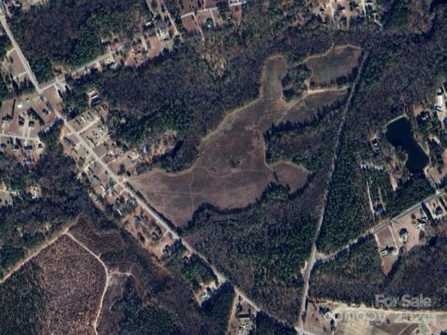 This 117-acre farm property offers an opportunity for those seeking a peaceful retreat or a working farm in the heart of the Palmetto State. Whether you dream of owning a fully operational farm, an equestrian estate, or simply escaping the hustle and bustle of city life, this property offers endless possibilities. With ample acreage at your disposal, let your imagination run wild. Conveniently located just a short drive from downtown Pageland, this farm combines the best of both worlds - rural tranquility and easy access to modern amenities. With fertile soil this farm is ideal for a variety of agricultural pursuits. Whether you're interested in raising livestock, cultivating crops, the possibilities are endless. With land becoming increasingly scarce, this property represents a solid investment opportunity. Don't miss out on the chance to own your own piece of paradise in Pageland, SC. Schedule a viewing today and experience the beauty and tranquility of country living at its finest!