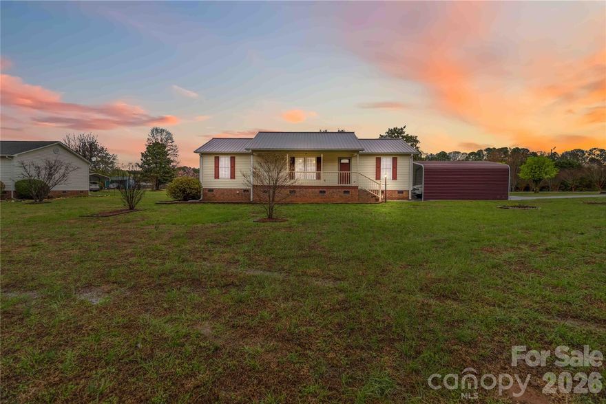 Charming 3-bedroom, 2-bath home on 1.33 acres featuring beautiful hardwood floors, fresh interior paint, and a
welcoming rocking chair front porch. Situated on a level corner lot with a beautifully manicured yard, this property offers space, comfort, and functionality. Enjoy outdoor living with a screened back porch and deck overlooking the spacious yard. Additional features include a metal roof, a two-car carport, a detached one-car garage, a workshop, and a storage building, ideal for hobbies, storage, or extra workspace. Plenty of room for outdoor activities while still being convenient to York, McConnells, and Rock Hill for shopping, dining, and commuting. A wonderful opportunity to enjoy country living with modern conveniences nearby.