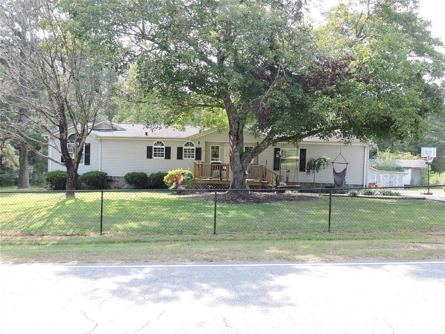 A meticulously cared for 3-bed, 2-bath home on a acre beyond city limits. Enjoy a fenced in backyard and a bonus storage building. A new septic system is on the way. The generously sized owner's suite offers ample space and an opportunity for a home office. Conveniently situated just 5 miles from downtown Troy, boasting boutique stores, coffee shops, and a skate park. With Pinehurst, NC 35 miles away and Albemarle, NC 20 miles away, this home offers both serenity and accessibility. Don't pass up the chance to make this beautiful home yours. This home will come with a New Septic system which is scheduled to be installed this week, weather permitting.
