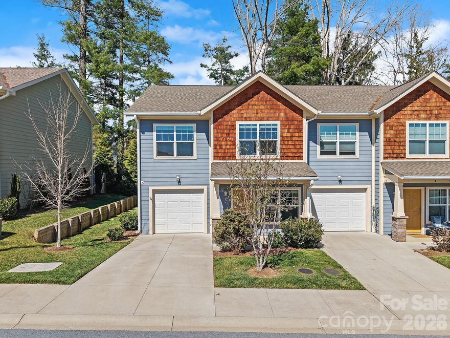 Located in a welcoming South Asheville community, this 2-story townhome offers a comfortable, well-designed layout with low-maintenance living and modern appeal. Built in 2019, the home features 3 bedrooms and 2.5 bathrooms with a natural flow that works for both everyday living and easy gathering.

The main level is filled with natural light, with a living room centered around a gas fireplace that adds warmth and character. The kitchen is bright and functional, featuring white cabinetry, granite countertops, stainless steel appliances, and generous prep space, opening seamlessly into the dining area and extending to a private outdoor patio surrounded by greenery.

Upstairs, the primary suite offers a quiet retreat with its own en suite bath, while two additional bedrooms provide flexibility for guests, a home office, or additional living space. The layout feels both practical and comfortable, with a nice balance of shared and private areas.

The community enhances the lifestyle with a neighborhood dog park and playground, offering space to connect and unwind. With an attached one-car garage and a location just minutes to shopping, dining, and everyday conveniences, this home delivers both comfort and convenience in one of South Asheville’s most desirable areas.