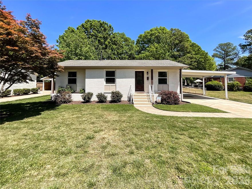Discover your dream home in the highly sought-after Cotswold/Oakhurst neighborhood! This beautifully remodeled gem sits in one of Charlotte’s most convenient and charming locations - walkable to Oakhurst Park with effortless access to Uptown, NoDa, Plaza Midwood, SouthPark, and an incredible lineup of top-rated dining, shopping, and entertainment options just minutes away. Remodeled in 2021 — no detail was overlooked. Step into a true chef’s kitchen featuring sleek granite countertops, gas range, custom solid wood soft-close cabinetry packed with storage, and an oversized walk-in laundry room that turns everyday chores into a breeze. This home flows beautifully from inside to out, connecting to a large covered patio and convenient covered 2-car carport — the ideal setting for year-round gatherings, lively backyard BBQs, or simply unwinding. Tucked away in the backyard is a rare and versatile bonus: a separate 269 sq. ft. fully finished, heated-and-cooled flex building. This flexible space can easily become a private home office, state-of-the-art gym, kids’ playroom, home theater, creative studio, guest suite, or your own peaceful retreat. The possibilities are truly endless.