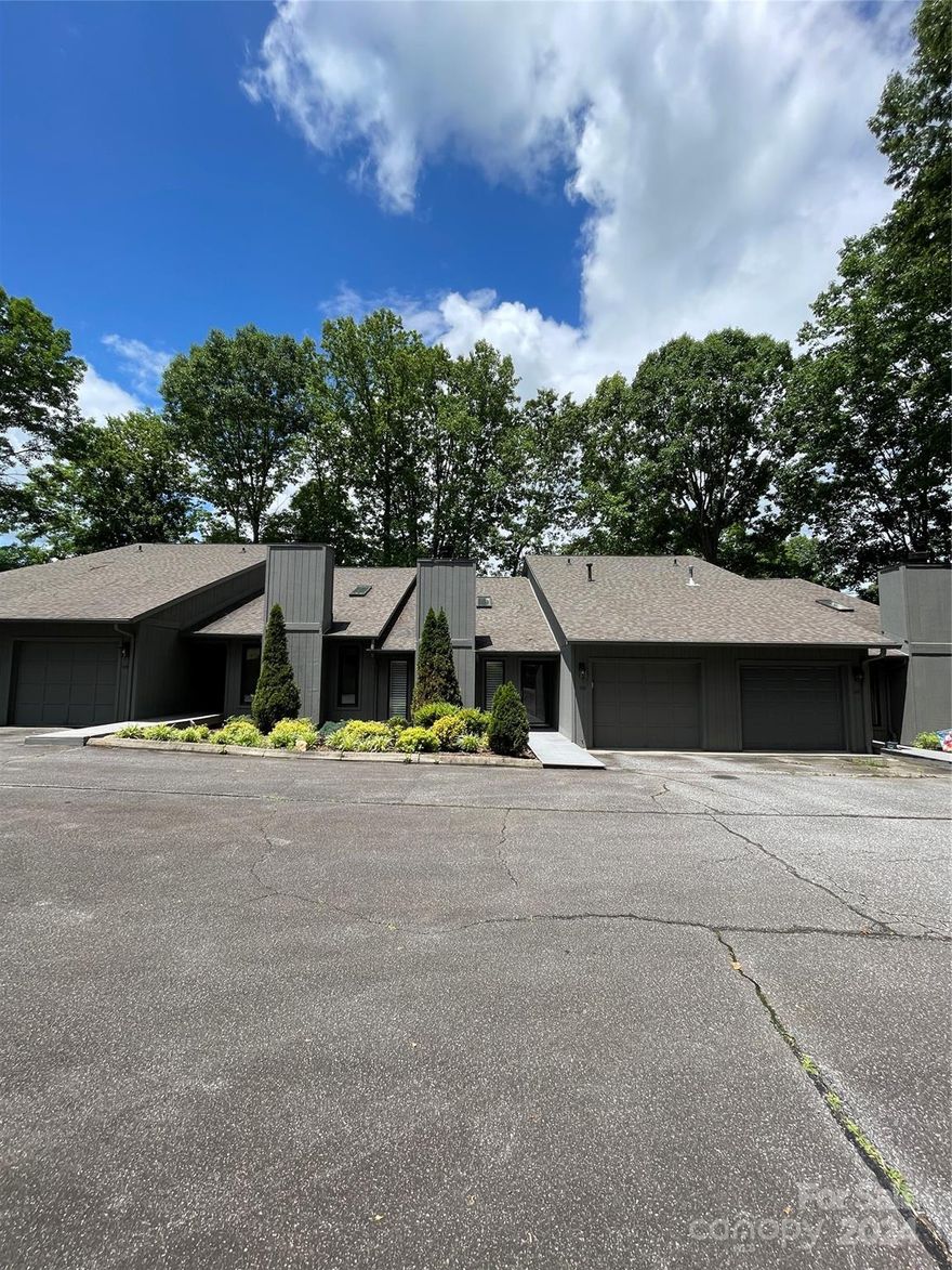 REDUCED AND BACK ON MARKET. NO FAULT OF SELLER!  Exquisite 2-bedroom condo nestled in a serene wooded neighborhood minutes from downtown Morganton. Surrounded by tall trees, condo offers a tranquil retreat from the hustle and bustle of city life. Unit boast a full upgrade including opening living space for the maximum open living concept.  It is stunning! The main living space has a gas fireplace with a beautiful natural wood mantel & a feature wall of white shiplap.  2 skylights welcome the natural light in. Looking through to the gorgeous kitchen you will see a massive granite countertop island for plenty of prep space & sitting space. A walk-in pantry is located under the stairs along with a built in pantry by the 5 compartment refrigerator. Extra spice racks by gas range & deep cabinet drawers makes this kitchen fabulous & functional. New sliding doors lead to a large deck for grilling or just relaxing. This unit is is an easy walk to the pool. All bathrooms were totally redone!