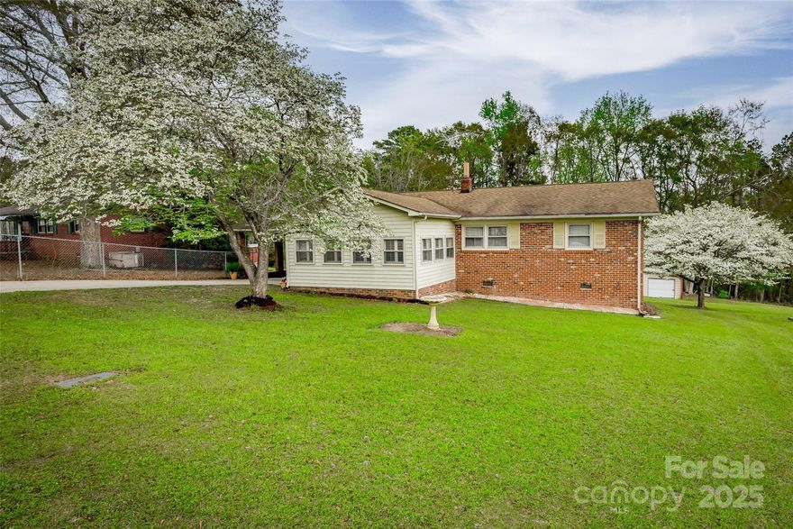 Great country neighborhood just minutes to I77 and perfect for commuters to Columbia, Rock Hill or Charlotte! This charming all brick ranch has a wonderful sunroom on the front and a deck overlooking your very own in-ground pool and patio in the back! The home has been very well taken care of and updated with laminate floors throughout, an expanded master en suite bath and a large walk in closet. The beautiful heart pine kitchen cabinets are accented by a solid surface countertop and also include stainless appliances. The dining area features sliding doors to the deck. You'll appreciate the attached double carport. Outside are multiple outbuildings. One workshop is 20x20 with concrete floors, lots of work space with cabinets and attached to an additional 13x20 storage shed. They have electricity and water. The round pool is salt water and framed by a concrete patio and also comes with all sorts of extra supplies.