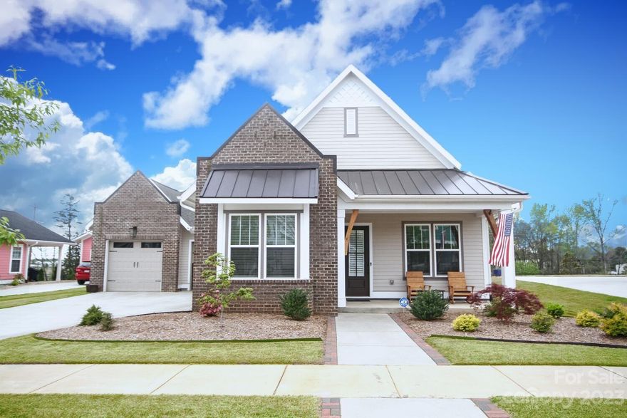 Immaculate, move-in ready RANCH in adventurous Riverwalk, on the Catawba river! Featuring stunning hardwoods & 10 ft ceilings throughout. Foyer adjoins home office/flex space & powder room. Two secondary bedrooms w/ Jack & Jill bath. Kitchen offers a large center island, beautiful granite, gas range, walk-in panty & breakfast area. Spacious dining room overlooks screened patio. Sunny great room w/floating entertainment center & built-in bar. Primary suite has carpeting, tray ceiling, sitting area & 2 huge walk-in closets. Primary bath has a large shower, double vanity, linen closet w/many cabinets. Oversized two car garage enters to drop zone w/ mud bench. Tankless water heater w/whole home filter. New landscaping & fenced yard. Low maintenance living in a vibrant community convenient to I-77 with restaurants and shopping nearby, bike & walking trails abound, rec fields, BMX track, river access, and NEW community pool w/Lazy River. The amenities are a must see at Riverwalkcarolinas.com