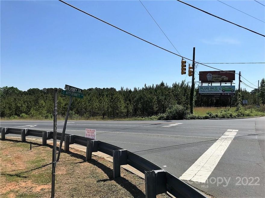 THE CORNER OF US HWY 74 AND KITTY BENNETT ROAD ACROSS FROM THE WALMART SUPER CENTER.  APPR 1.69 ACRES WITH STOPLIGHT AND HEAVY TRAFFIC COUNT.  EXCELLENT SITE FOR MANY POTENTIAL RETAIL BUSINESSES.  ADDITIONAL PROPERTY AVAILABLE BY OWNERS FOR A PLANNED RETAIL CENTER.