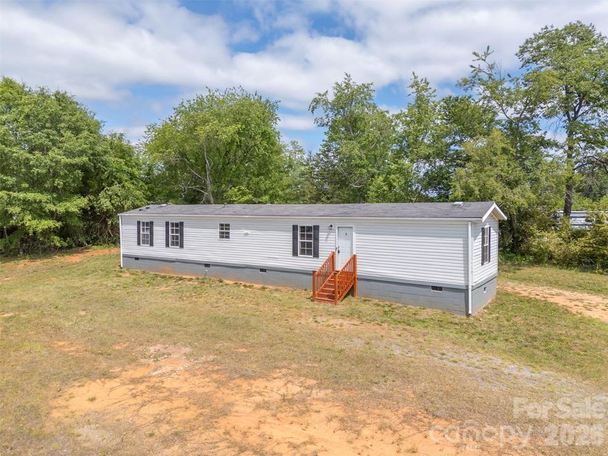 Affordable, updated, and ready for you to move right in! This renovated single wide manufactured home features 2 bedrooms, 2 full bathrooms, and 924 square feet of thoughtfully refreshed living space, all set on a beautiful 1-acre lot. The home has been updated throughout with new flooring, fresh paint, and modern fixtures, giving it a clean and inviting feel from the moment you step inside. The layout offers a comfortable balance of space and functionality, ideal for everyday living. Outside, the completely cleared and level lot provides endless possibilities—whether you’re looking to enjoy open space, start a garden, or simply appreciate the privacy of your own acre. Two metal storage buildings convey with the property, offering additional space for storage or projects. Whether you're a first-time buyer, downsizing, or looking for an affordable investment opportunity, this property delivers great value at an attractive price point. Don’t miss your chance to own this turnkey home with room to grow!