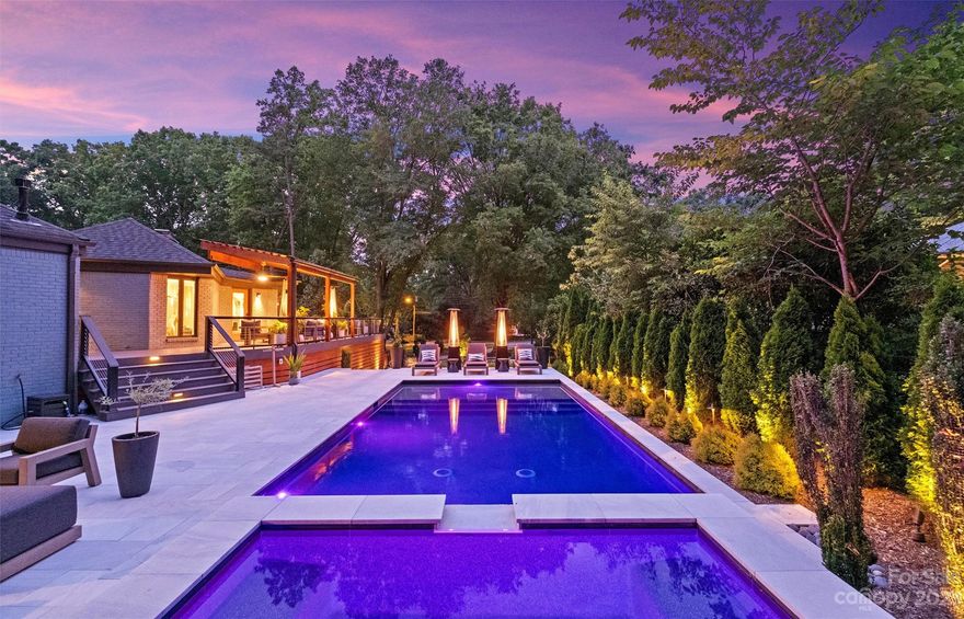 Welcome to this MODERN masterpiece in the heart of SouthPark! This fully updated property offers elegance, while situated on a professionally manicured .70 acre lot. Featuring 4 bedrooms and 3.5 baths, this home has tons of living space on the main level. Oversized family room with tons of windows, overlooking the lush landscaped yard. The gourmet kitchen is a chef's delight, complete with waterfall island & custom shelves. The lower level layout features a second living room, guest bedroom, full bath and extra large storage room. The backyard oasis offers a salt water heated pool with spa, Baja shelf, covered and open outdoor living with over a 1000 sq/ft of white marble patio pavers and Azek deck for relaxing. Other highlights include raised garden beds, dual driveways, wet bar and wine fridge in LR, tray ceilings, 3 fireplaces, built-in shelves, LVP on lower level, and encapsulated crawl space. Lot is laid out to have a 2-3 car garage or carport. Conveniently located to everything!