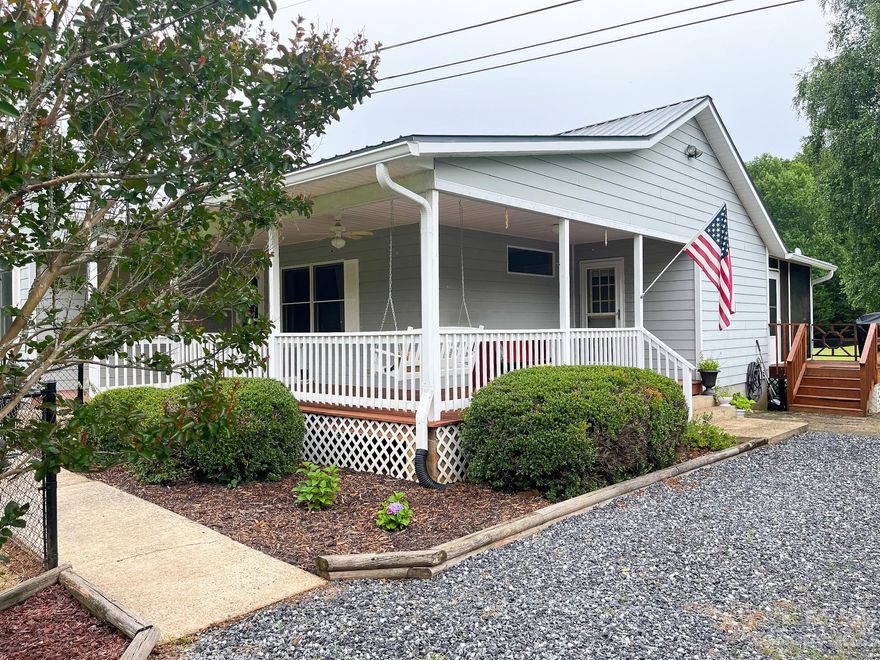 Beautifully maintained one level living conveniently located between Sylva and Franklin. This home has a bonus room creating a 3rd bedroom or office. Completely level yard with a natural spring running through. Gorgeous mountain views. A complete half acre of property fenced in perfect for your animals. Updated appliances throughout including a tankless water heater, just waiting for you to make it home.