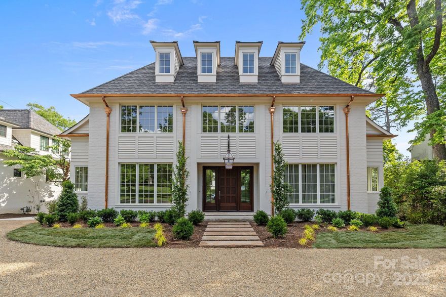 Stunning new construction in Myers Park! Blending timeless elegance with modern comforts, this thoughtfully crafted home by Aaron Cote Architecture & Thompson Building Group is one of a kind. The entry & formal dining room flows into an open-concept layout, featuring a spacious family room with fireplace & custom built-ins, chef’s kitchen with large center island, marble countertops, high end appliances, & butler's pantry - offering plenty of storage. The drop zone, office & incredible primary suite on main provide comforts & functionality for the family. The upper levels feature generously sized bedrooms with en-suite baths offering privacy along with multiple flex spaces for entertainment, office, exercise - suited to your lifestyle! The covered porch with fireplace, Detached 2-car garage, Copper Gutters & custom Mahogony front door, are just a few of the fabulous details in this exceptionally designed home!