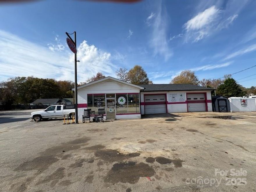 Located  #814 South Main Street (Highway 321 South) Clover, South Carolina, .25 Acre CORNER RETAIL STOREFRONT /AUTO / TRUCK REPAIR PROPERTY CONSISTING OF #2528 Square Foot Main Concrete block Building which INCLUDES A 27' X 14' END DRAFT PAINT BOOTH, Plus a 36' X 21' DOUBLE DOOR AUTO / TRUCK Repair Shop with #10,000 lb., "VINPAC" electric vehicle Lift, w/#2 Air Compressors ; 3 PHASE POWER % DUKE ENERGY, YORK COUNTY NATURAL GAS, City of Clover Water & Sewer, #1,000 Gallon Above Ground Diesel Tank, #500 Gallon Above Ground Gasoline Tank, A T & T Fiber Optic Hi-Speed Internet Connection.
*This property has TWO BUSINESSES operating out of this location WHICH MAY BE PURCHASED IN ADDITION TO OR SEPARATELY FROM THE REAL ESTATE; #1.) Clover Towing and Recovery, LLC which is on the pick-up rotation list for the South Carolina HIGHWAY PATROL, York County SHERIFF'S DEPARTMENT, and CLOVER POLICE DEPARTMENT #2.) Truck and Trailer Sales of York County, LLC which has #12 Dealer Tags (#8 Cars and #4 Truck Tags). There are #2 Rollback Trucks ( both with JERR-DAN Bodies), and 1 Heavy Duty Wrecker that may be purchased separately with considerable additional operational equipment to go with them ...
*Owner's reason for selling is simply to pursue other related business interests.