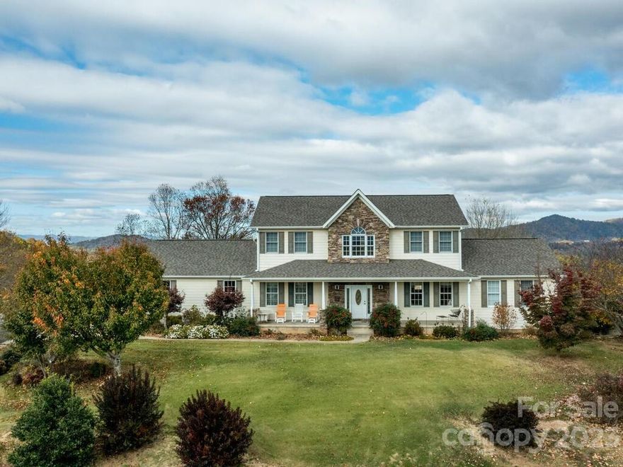 This is definitely one of Madison County's prized jewels! You will love this like new spacious 4/4.5 house with views that will never cease to awe you. 36 rolling acres for your animals or crops. Two big barns, a separate 24x36 woodworking shop with some tools. Huge semi-finished basement with a fully finished bath and closet. Fruit trees, abundant wildlife, and only 10 minutes to Mars Hill or Marshall and 30 minutes to Asheville. A warm and inviting home-sweet-home place to live.