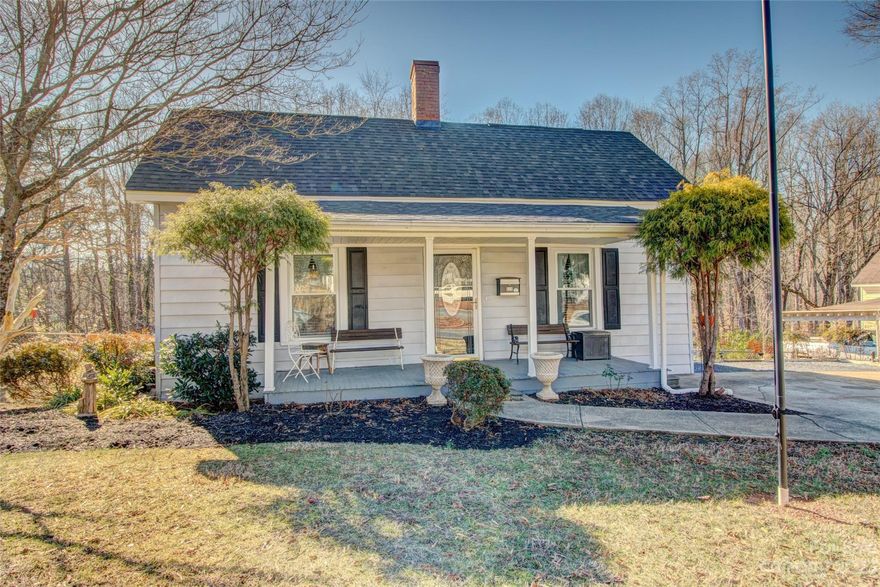 Welcome to a charming two-bedroom, one-bathroom bungalow that effortlessly combines classic comfort with modern amenities. Nestled on a large lot conveniently located near downtown Cherryville, this bungalow ensures easy access to local amenities, shops, and community events, enhancing your overall living experience.  Inside, discover a well-appointed kitchen featuring granite countertops and an inviting eat-in area, a spacious living room, and a primary bedroom that walks out to the covered deck.  Very spacious fenced-in backyard and storage building with electricity.  Schedule a viewing today and envision the possibilities of calling this beautifully situated residence your new home.