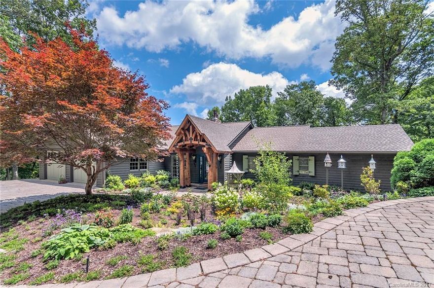 Welcome to Arrowalk – a scenic, private sanctuary & stunning mountain home, experience amazing mtn views, mins to DT AVL. Mountain living w/modern extravagance. Enter through the beautiful iron gate & drive long, winding driveway & be captivated by the woodland setting & stone walls. The home’s exceptional design, custom stonework, wood features, cathedral ceilings & light-filled floor plan provide beauty & function. This extraordinary residence & property will captivate the discerning buyer.