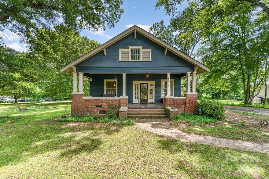 Gorgeous Craftsman Bungalow in near-original condition on oversized lot in up and coming Derita area some call Derita Village.  Less than a mile to the proposed Derita Station on the Red Line commuter rail.  If you yearn for a classic historic home to modernize and update to your taste and budget this is the home for you!  Large bedrooms, hardwood floors, living room, dining room and butler's pantry/breakfast nook plus quintessential front porch ready to live in and update over time. Kitchen has new countertops and range hood.   Lots of extra value in the large lot with 149 ft of road frontage.