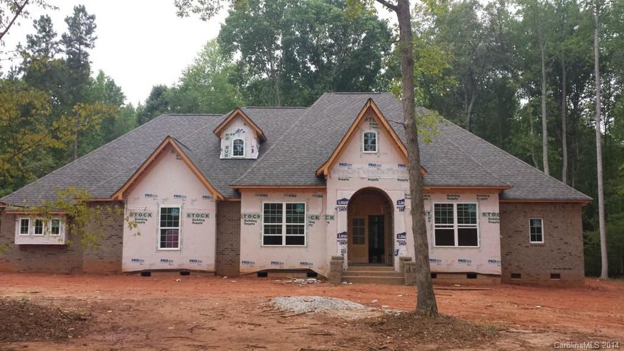 Under Construction! What glorious attention to detail in this Gorgeous Brick & Stone Home situated on over 2 acres! Step through Mahogany front doors to enjoy travertine floors with intricate inlay. Hardwoods, Granite throughout. Beautiful tile work. Architectural Arches & Niches. Master on Main. Fireplace in Great Room. 2nd Fireplace in Upstairs Bonus Room. 2 Surround Sound systems, Wooden shelving in all closets/ pantries. Covered Porch overlooks large stamped concrete patio. Clover Schools.