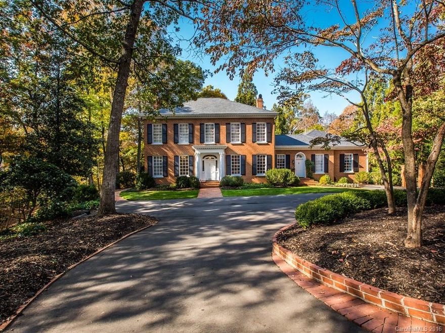 Elegant Custom brick home on stunning private 1.5 acre lot overlooking a private pond is a hidden gem.It has the it all plus the most gorgeous lot.Amazing outdoor living features a stunning covered brick veranda overlooking a tranquil country setting just minutes from Uptown & Southpark.Well appointed formals including living room, dining room & library.Intricate moldings, 3 fireplaces & hardwood floors.Secondary full kitchen suite w/separate entrance. Generous family room w/wet bar.Very Unique