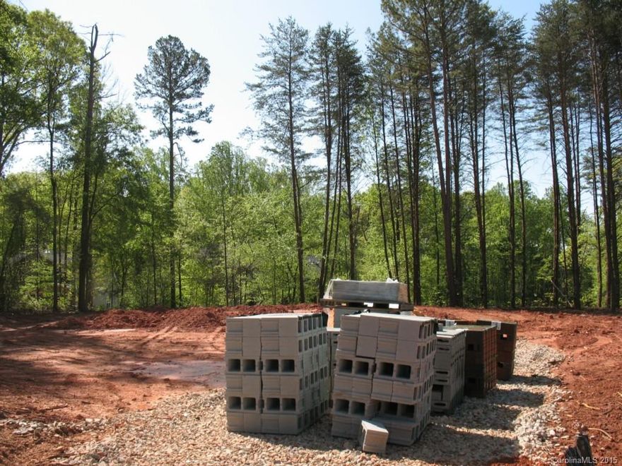 The Wrightsville Customized O-Version on LOT 59 * Beautiful Big Ranch on Heavily Wooded 1/3 Home Site * Custom Features: Open Kitchen w/Granite Kitchen Countertops, 42" Cabinets w/Crown Molding, Huge Island, Butlers Pantry, Oversized Pantry. Custom Large Formal Dining Room. Family Room features: Vaulted Ceiling, Custom Art Niche, Wood Burning Fireplace w/Granite Surround, Main Level Owners Suite w/ Tray Ceiling, Dlx MBA. Upper Level Bonus Room / Bedroom #4 w/Full Bathroom. Walk-In Attic Storage.