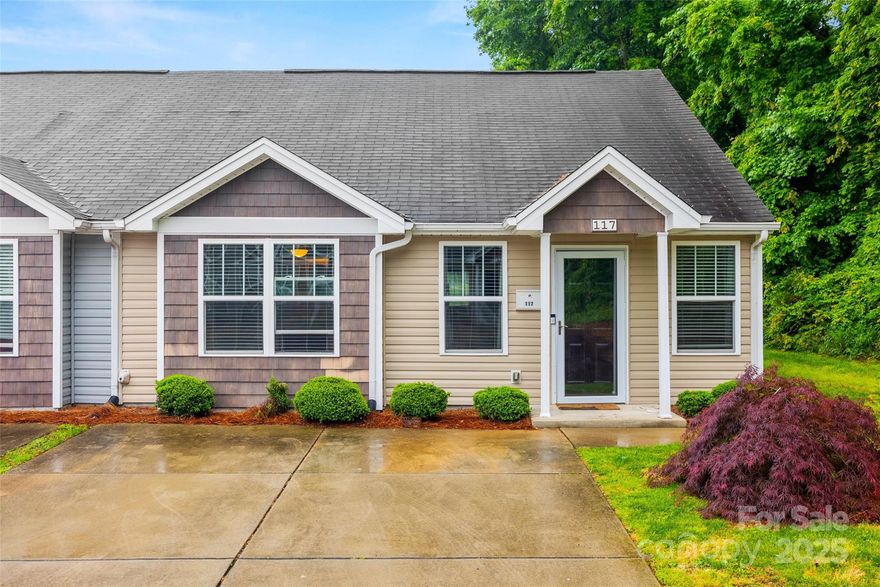 Welcome home to this meticulously maintained end-unit townhome in sought after Mountain Island Village! Step inside to discover brand new flooring seamlessly flowing throughout the open-concept layout. Complemented by freshly painted walls and trim - this home provides a clean finish ready for your personalization. The living area boasts vaulted ceilings & flows perfectly to the kitchen, creating an airy & inviting atmosphere paired with a functional design - perfect for both everyday living & entertaining. Both bedrooms are generously sized, with the primary suite offering vaulted ceilings, a large walk-in closet, & en-suite bath. Situated at the end of a quiet street, enjoy added privacy & outdoor space. With exterior maintenance & lawn-care covered, spend your weekends doing more of what you love - Enjoy easy access to shopping, dining, outdoor recreation, & ample community events in downtown Mt Holly. Don't miss your opportunity to own this move-in ready gem in a vibrant community!