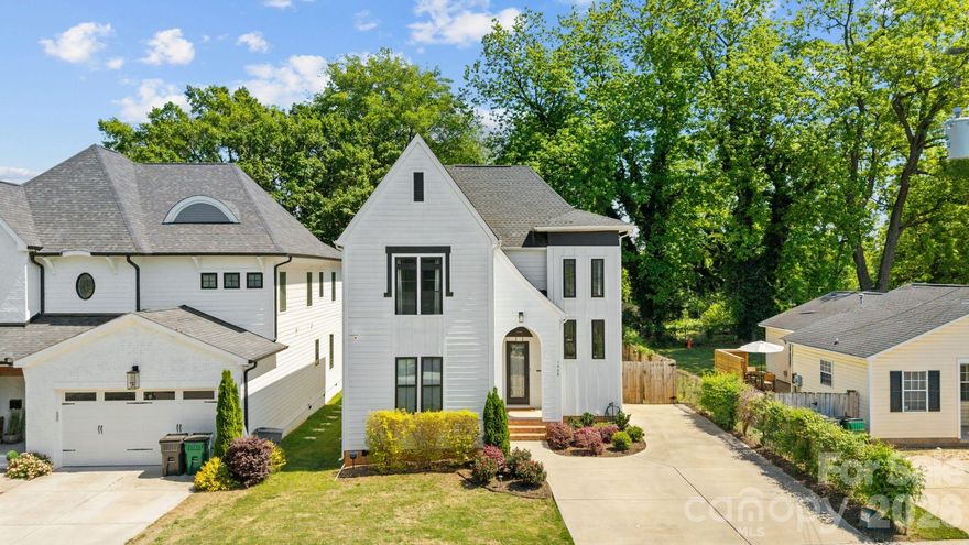 Experience urban lifestyle in the heart of Optimist Park, where Optimist Hall, the Light Rail, NoDa favorites, and local breweries are just moments away, paired with effortless access to all that Plaza Midwood and Uptown Charlotte have to offer. Impeccably constructed and thoughtfully designed, this residence showcases an open-concept floor plan. The custom craftsman kitchen is a true centerpiece, with a walk-in pantry and abundant storage. The seamless flow into the dining and living areas extends to your private outdoor retreat, complete with a covered walk-out deck with a striking see-through gas fireplace, leading to an expansive patio and your large fenced in backyard with a large shed for additional storage. The main-level primary suite offers a luxurious escape, complete with an oversized walk-in shower, dual-sink vanity and a custom-designed walk-in closet. On the upper-level, you will find a spacious flex living area, a private en-suite bedroom and two additional bedrooms connected by a Jack-and-Jill bath, adorned with custom tile work. This is truly sophisticated urban living without compromise!