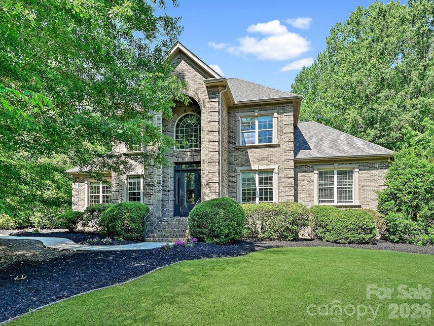 Welcome to Trinity Ridge, one of Fort Mill’s most beautifully curated communities, where this impeccably maintained custom home sits on a private 1.33-acre homesite featuring a stunning gunite pool and exceptional outdoor living.

Freshly updated with new paint, newly refinished kitchen cabinetry, and upgraded lighting, this ~5,000+ sq ft home offers timeless custom quality with a true move-in-ready feel. The main living area features a spacious, open layout with two primary suites on the main level—including a generous primary with a flexible adjoining space ideal for a gym, office, or private retreat—along with a dedicated main-level office.

A standout feature is the expansive secondary living quarters—approximately 2,000 square feet—occupying the entire rear wing of the main level. Designed for true multigenerational living or extended guests, this fully self-contained space includes a private kitchen with breakfast area, and pantry, laundry, a large family room, a spacious primary bedroom with en-suite bath and walk-in closet, two additional bedrooms connected by a Jack-and-Jill bath, or a dedicated study, and private access from the garage. Thoughtfully separated from the main living areas, it offers the feel of a private residence under one roof.

Upstairs, a large bonus room above the attached 3-car garage provides ideal flex space for media, recreation, or play. There are also three additional bedrooms upstairs—one with a private en-suite bath, while the other two share a Jack-and-Jill bath and an upstairs laundry room.

The detached 2-car garage includes heated and cooled space above—perfect for a home office, studio, or private retreat. With 5 total garage bays plus room for a golf cart, workshop, or hobby space, this property offers rare functionality.

A true custom home offering acreage, a pool, extensive living flexibility, and exceptional garage capacity in Trinity Ridge—opportunities like this are rare.

Please join us for our Open House on May 16th at 11:00 AM. Private, timed showings to be scheduled through Showingtime—

**The detached garage was originally permitted; however, the permit was not finalized and has since expired. The finished space above the detached garage is heated and cooled, but it is not included in the home’s reported heated square footage.**
All measurements and calculations are deemed highly reliable, but not guaranteed.
