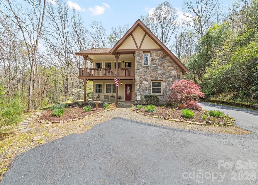 Immaculately maintained and full of character, this private 6-acre retreat—offered for the first time on the market—is ideally located approximately 2 miles from WCU and just minutes to downtown Sylva and outdoor recreation. The property features a peaceful setting with mature landscaping, garden area, a small creek/stream, and an old logging road perfect for hiking. The home offers 3 bedrooms, 2 baths, and a versatile loft, along with two covered porches for enjoying the natural surroundings. Interior highlights include a stone fireplace with new ventless insert (2026), luxury vinyl flooring (2026), and fresh interior and exterior paint (2026), creating a warm, move-in ready space. Recent updates include new mini-splits (2025), electrical breaker box (2025), resealed driveway (2025), and septic pumped and inspected (April 2026). Additional features include a 2-car carport and small storage shed—an exceptional opportunity for a well-maintained home with acreage in a highly convenient location.