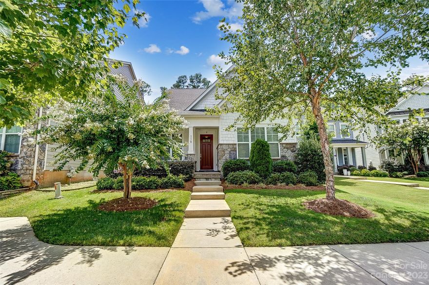 Absolutely Charming Home in the heart of Fort Mill, SC! This beauty features the Primary Suite on the main level and also has a huge finished room over the garage with a full bath and walk in closet! Step in from the welcoming front porch and into a spacious open floor plan! Gourmet Kitchen with large island, gas cooktop, vent hood and upgraded appliances! Windows line the dining area and the adjacent family room, which is just perfect for gathering! Head up to the loft, with endless possibilities, 2 additional bedrooms, a full bath and fantastic storage spaces! Rock away on the front porch or hop out back to the covered patio to relax! Finished room over garage with a full bath is a dream!! Extra parking pad added behind garage! Enjoy the community pool, playground, pond or take a quick stroll to the shops and eateries right in Brayden! Fort Mill Schools and just minutes to Baxter Village, Kingsley, Downtown Fort Mill and all that Uptown Charlotte has to offer! Welcome Home!!