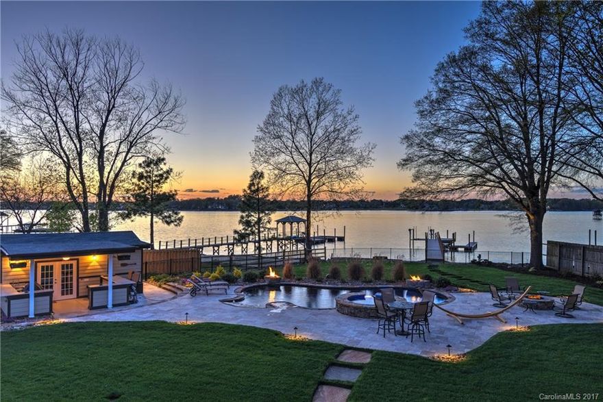 Amazing waterfront home in Cornelius w/ updates galore, over $450,000 since 2014! Complete basement remodel creating a 2nd living quarters w/ full kitchen, 2nd Master w/ lake views, full bath, dining area, large flex space & additional bedroom.  Upstairs features a complete kitchen remodel including new appliances, granite & custom cabinets.  Outside boasts a salt water pool (heated & cooled), hot tub, pool house, fire pit, updated pier w boat slip & lift. No HOA, 1.27 acres. (5th Bed-No Egress)