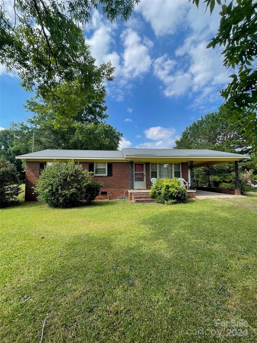 Explore the potential of this charming all-brick ranch style home! Step outside into a spacious backyard full of possibilities. With a recently upgraded HVAC Gas Pack and roof, this home presents an excellent investment opportunity. Original 1970's finishes lend character and a blank slate for renovations. Enjoy the convenience of being only 8 minutes from downtown Lancaster's vibrant Main Street, with its shops, dining, and community events. As well as close proximity to Cane Creek Park which ensures easy access to outdoor activities and serene surroundings. Plus only 21 minutes to downtown Waxhaw. This property is poised for transformation. Whether you're looking to invest or create your own cozy retreat, schedule a showing today and envision the possibilities!
