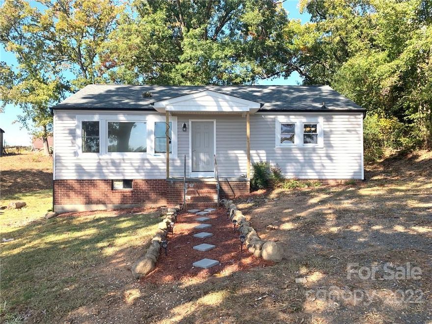 This newly remodeled home is just what you have been looking for. Enjoy this 3 bedroom home with a great room and updated eat in kitchen and updated bathroom. New flooring throughout the home. New roof. Home is situated on almost one-half acre. City water and sewer services the home. Extra tall storage area below the home with double wide access door. Perfect for securing your lawn equipment.