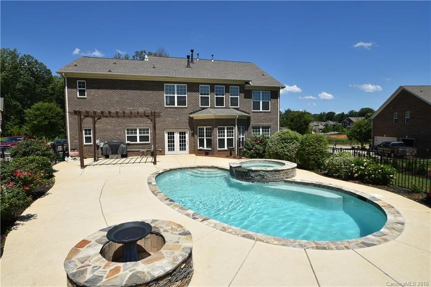 THE HOME YOUVE BEEN WAITING FOR! SALT WATER POOL W/ HOT TUB & FIRE PIT, FULL BRICK, 3 CAR SIDE LOAD GARAGE, FENCED IN HUGE BACK YARD & IRRIGATION. OPEN FLOOR PLAN W/ HARDWOODS, TILE, HARDWOOD STAIRCASE, HEAVY MOLDING THROUGHOUT, BLACK WROUGHT IRON RAILINGS & SURROUND SOUND. KITCHEN W/ GRANITE, GAS COOK TOP, BACK SPLASH W/ OPEN FIREPLACE TO ENJOY COZY DINNERS. LARGE OFFICE & BEDROOM ON THE MAIN LEVEL W/ FULL BATH, LARGE MASTER BEDROOM, FULL THEATER ROOM UPSTAIRS. MUST SEE THIS HOME! WILL NOT LAST