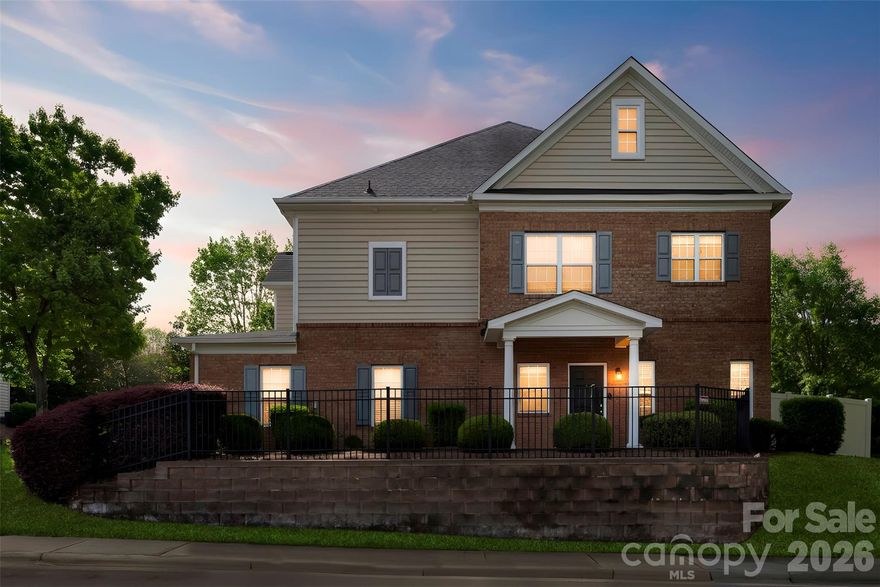 Well-maintained end-unit condo in a desirable Ballantyne-area, offering added privacy, natural light, and an easy in-and-out location at the front of the neighborhood. This unit stands out with its fenced patio area and private outdoor space. The first floor features an open-concept layout with a spacious living room, dining area, and kitchen complete with granite countertops, stainless steel appliances, and a center island. Wood flooring and a cozy fireplace add warmth and character, along with a convenient half bath for guests. Upstairs, the second level offers a primary suite with its own full bath, an additional bedroom, another full bathroom, and laundry. Updates include new second floor carpet (2024) and a newer HVAC system (2022) and extended patio. Additional highlights include central heat and air, a two-car garage, and access to community amenities including a pool. Conveniently located near shopping, dining, and everyday essentials, with some options just a short walk away.