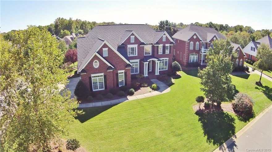 Breathtaking FULL BRICK Wieland "COLUMBIA" Model Home w/ALL THE UPGRADES! This 3 Story 4,806 sqft 5BD/5BA Home is one of the Newest Homes in Community! Walking Distance to Pool & Comm. Amenities! Bedroom on Main w/Full Bath! AMAZING Kitchen SS Appl/ Italian Granite, Island, Gas Cooktop! Extensive Hardwoods, Newer Carpet, Lighting & Plumbing Fixtures! Huge Master Suite & Luxury Bath! 3rd Floor Media/Rec Rm w/Full Bath! Irrigation~EXT Lighting~LRG Private Fenced Backyard! 3 Car Gar! Home Warranty