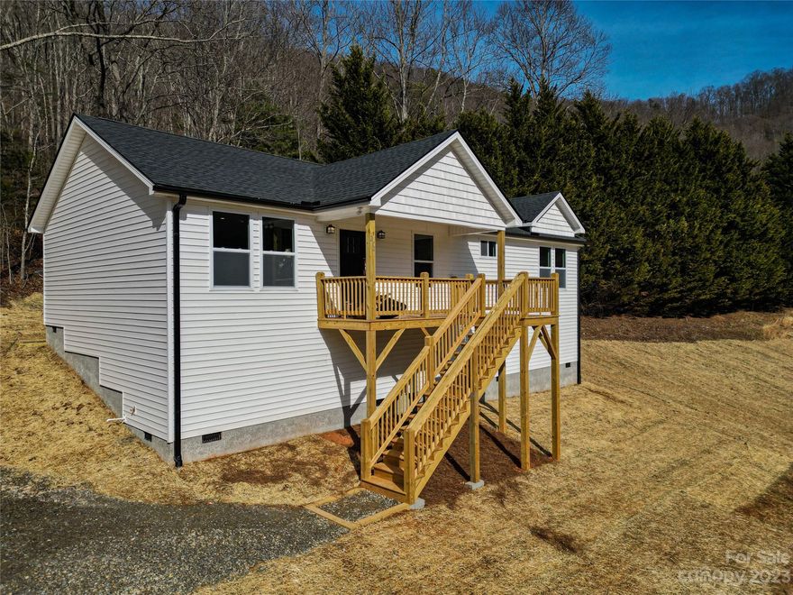 Stunning views with some peace and quiet. Big yard on almost an acre of land. Eller Cove has no through traffic furthering the quiet nature of this valley location. Brand new construction only 8 minutes to downtown Weaverville. Open floor is plan bathed with warm natural light and is perfect for entertaining. Roomy primary bedroom boasts a large walk-in closet and elegant primary bath with dual vanity and custom tile shower. Luxury vinyl plank flooring, fabulous kitchen with stainless steel appliances, granite counters, spacious all-plywood soft close cabinets, under cabinet lighting, and the perfect kitchen island. Neutral colors make decorating a breeze. Large decks are a spectacular place to enjoy that clean mountain air. Finished interior pictures are shown as an example. Finishes are usually consistent, but may vary slightly depending on product availability. Tax value based on previous vacant land and does not represent current improvements.