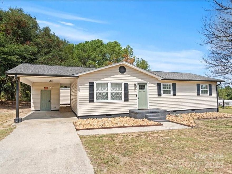 Completely renovated and move-in ready, this 3-bedroom,1.5-bath home is nestled on nearly 3 acres of beautiful, wooded land. The thoughtfully updated eat-in kitchen shines with brand-new appliances, granite countertops, and a convenient 4-seat bar, perfect for casual dining or entertaining. A centrally located laundry closet adds everyday ease. Modern lighting and beautifully restored hardwood floors bring charm and character throughout the home. Both bathrooms have been fully remodeled with today’s finishes, giving the space a fresh, updated feel. Step outside and enjoy the peaceful setting with a large, quiet yard, ideal for gatherings, play, or simply relaxing. Additional storage is available with an oversized outbuilding, complete with a large door for lawn equipment and more. This special property offers the best of modern updates, outdoor space, and timeless appeal and is all ready for its next chapter.