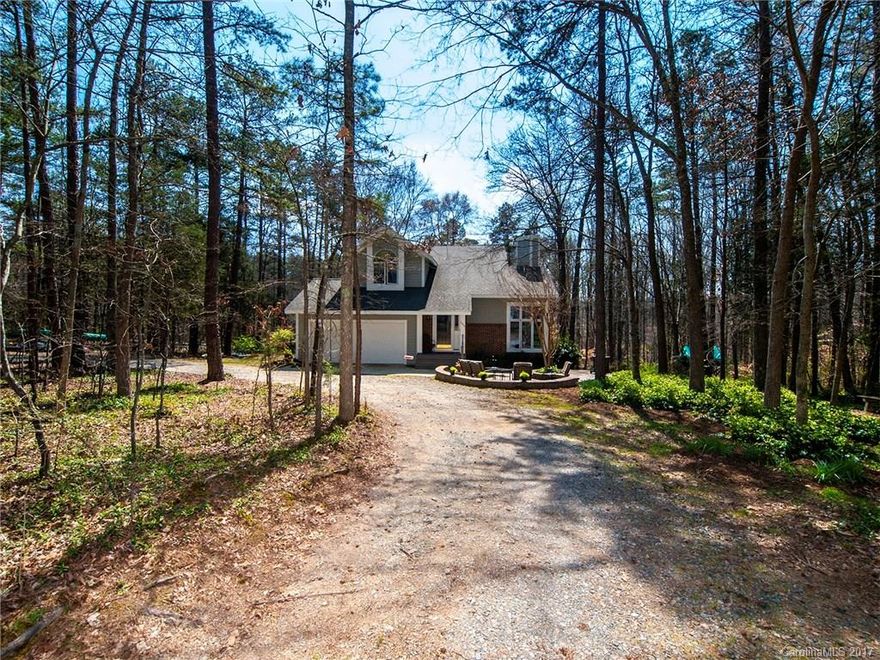 Looking for acreage in Huntersville?  You have found it!  This home has nearly 3 acres and is located in Mecklenburg County.  In addition to this picturesque setting is a precious home that has been immaculately maintained.  Three full bedrooms and 2.5 baths complete this floorplan with two-story great room, den and updated kitchen.  This home has a partially completed, heated basement that is perfect for recreation and/or a workshop.  Please take a look at the list of additional features!