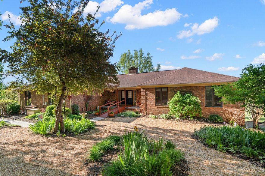 What a wonderful and rare property, it is a birders paradise and the bird houses are located in many of the mature trees! Boasting well over 3000 square feet, this lovely home offers ample living space including two primary bedrooms. In addition, there are several flex spaces that can be used for various purposes such as a home office, workout or craft room. Entering through the living room you will feel at home as you notice the wood-burning fireplace.  There is also a large deck overlooking the trees which only adds to the natural beauty of the almost 7+ acres, offering privacy & space to enjoy many of your outdoor activities. There is an oversized two-car garage on the main level, convenient to the kitchen & the  spacious pantry. The bright sunroom, on the front of the home, offers the tranquil sound of a waterfall that is home to several coy fish.  It wouldn't be home without the cozy fire pit for gathering with family & friends. It is landscaped for all of wildlife to enjoy!