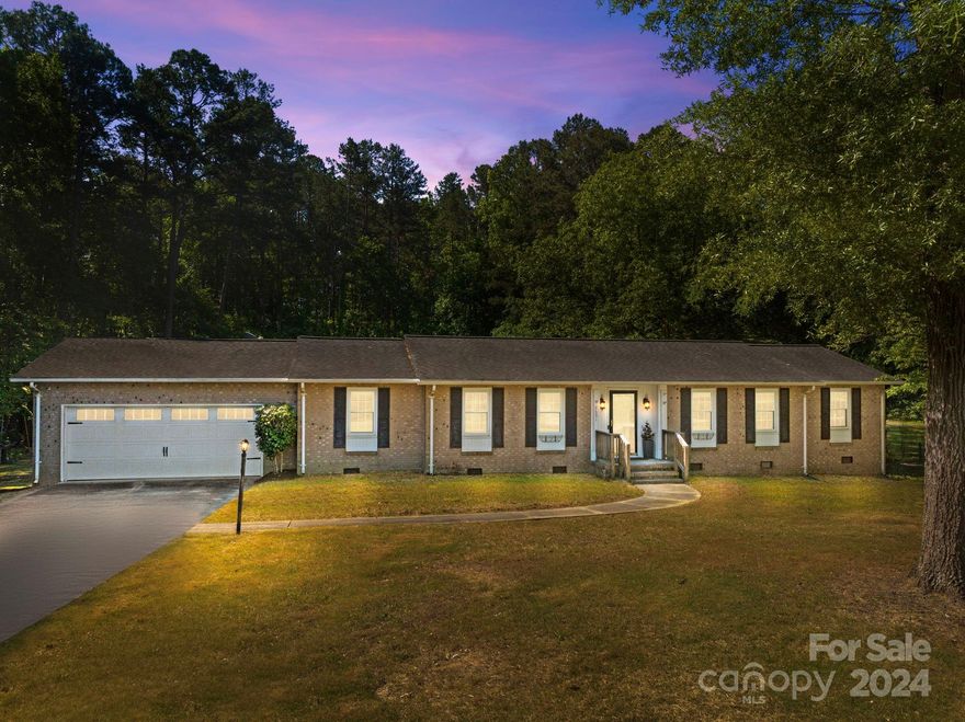 Welcome to this spacious one-story brick ranch with 4 bedrooms and 3 full baths on almost an acre of land! This house nestled at the end of the quiet neighborhood features an open floor concept, recently renovated bathrooms and new flooring except carpets. Freshly painted. Stainless steel appliances & granite counter tops in kitchen. The huge backyard is peaceful and private. Spacious and partially covered deck opens to the fenced-in private backyard. It is perfect for you to entertain your guests or just enjoy your coffee on this huge deck surrounded by the sounds of nature looking out onto established trees. This home provides easy access to local schools, shopping, dining, and entertainment. Plus, NO HOA FEES! The shed in the back conveys with the home.