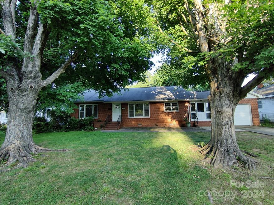HOT HOT HOT! Check out this charmer! 3 BD 1 BA brick home with 1 car garage and luscious fenced backyard area perfect for entertaining or relaxing under the covered patio.  Home offers gorgeous refinished hardwood floors, fireplace in living room (gas logs), built in cabinetry in dining and kitchen, and fresh interior paint. Take a look at the front patio area perfect for outdoor dining or enjoying your morning coffee. HVAC 2019. Roof replaced approximately 2017/2018. Located with close proximity to Novant Medical, VA Hospital, Catawba College, local parks, shopping, local businesses and dining. Home is just over a mile to the new Bell Tower Green Park in the heart of Downtown Salisbury!