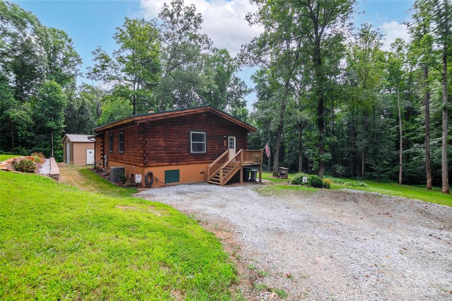 Here's a great opportunity  to own a log cabin on an unrestricted acre of land in a convenient location.  This home is convenient to Hendersonville, Fletcher, and interstate 26, yet features end of the road quiet privacy.  Inside, the home features 2 bedrooms and 2 baths with a bonus room.  With high ceilings and an open floor plan the home feel spacious! Outside there is a 24x24 detached garage and a fenced area for animals.  There is plenty of room for gardening and outdoor activities of all types. With no restrictions on the property you can have a great mini farm or a vacation rental. Come see all this property has to offer!