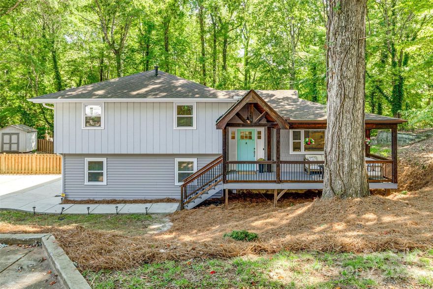 Welcome home to this charming 3 Bedroom, 2.1 Bath contemporary Tri-Level home located just half mile from Tega Cay Marina. Step onto the large covered front porch, perfect for morning coffee or relaxing evenings. Inside, the spacious living room flows into a modern eat-in Kitchen with plenty of cabinet space, and Stainless Steel Appliances. Upstairs, you'll find the Primary Bedroom that leads to an outdoor deck, 2 well sized bedrooms, all rooms provide ceiling fans and ample closet space. The lower level is a versatile recreation room featuring a cozy fireplace, built in shelving, built in seating w/space for dining + space for a home office. The fully fenced backyard provides a private retreat for you and your pets with a concrete patio and deck. Enjoy the vibrant community where neighbors cruise around in golf carts, and you're just a short walk to Runde Park, The Shore Club and a half mile from Tega Cay Golf Club. This home offers comfort, convenience, and a lifestyle you'll love!