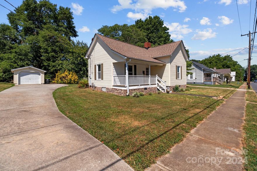 Charming 1 bedroom, 1 bath home in China Grove-perfect for cozy living, a starter home, or a rental! This updated property features 10 ft ceilings, crown molding, welcoming front porch & lots of character.  The kitchen has been updated and has all stainless steel appliances, modern fixtures, and a large unique copper farmhouse sink, adding a touch of rustic elegance. The hardwood floors throughout the living room and bedroom create a warm, inviting atmosphere with neutral tones throughout. Outdoors, the detached garage provides ample storage for one car or an excellent workspace. There is also an additional storage shed and fire pit area. The roof is less than 5 years old, giving you peace of mind. Home is conveniently located around the corner from downtown China Grove and near both Hwys 29 & 152 & I-85, offering easy access to local amenities and commuting.