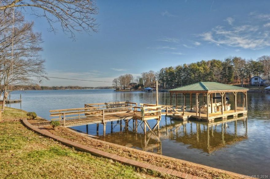 Spectacular open water views from this lake cottage.  The home sits on over a half an acre and has over 165 feet of shoreline.  The home features 3 nice sized bedrooms and 2 full baths. Enjoy affordable lake living with this adorable lake cottage, use it as a vacation rental, or build your dream home on this great lot.  Convenient location is close to everything Mooresville has to offer and is just minutes to Brawley School Rd.  Come take a look at this view, you won't be disappointed!