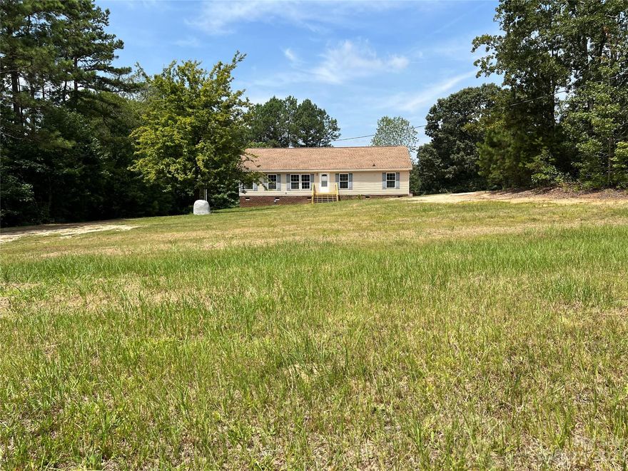 Beautiful country home sitting on a very private 3.82 acres. Very quiet and peaceful with a big yard and woods to explore! Fully renovated with high quality granite countertops and new stainless steel appliances. New tile backsplash. All new LVP flooring throughout the entire home. New light fixtures. Wood burning fireplace. All three bedrooms have large walk in closets. Bring out the four wheelers and hunting gear, this is a must see!