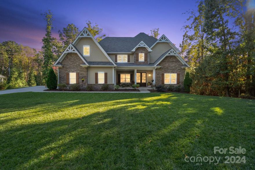 Discover serenity in this 4BR, 3.5BA haven on a wooded 1-acre lot. Watch deer and wildlife in your backyard. Grand staircase, chef's kitchen with a massive granite island, luxurious master bath, 12ft doors, and rustic entrance. Enjoy sensor lighting, central vac, water filtration. Extended living with a screened porch and a private backyard fireplace. Your dream home awaits!