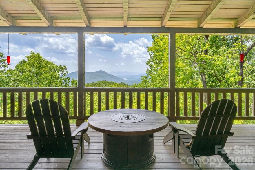 Enjoy the peace and privacy of nature in this true mountain retreat, all while being just minutes from Asheville and other popular destinations. Designed to capture the beauty of its surroundings, this home features a stunning wraparound porch, sunroom, and screened-in porch—perfect for taking in panoramic views of Lake Lure nestled in the valley below, with mountains rising on every side. This well-maintained home showcases quality construction throughout.

Built to highlight the breathtaking scenery, the home offers convenient main-level living with layered mountain views. The light-filled kitchen features ample cabinetry, or step outside to cook on the screened-in porch while enjoying the fresh mountain air. 

Upstairs, you’ll find a loft currently used as an office, along with a full bath and a spacious bedroom offering beautiful mountain views.

The lower level provides a warm and inviting space with an additional fireplace—perfect for entertaining or relaxing with a good book. This level also includes a large bedroom and full bath.

You’ll also find a garage and workshop on the lower level, offering plenty of storage and functional space.

Rustic charm blends seamlessly with modern comfort, featuring warm wood interiors, soaring ceilings, and thoughtful craftsmanship throughout, including impressive handcrafted floor-to-ceiling fireplaces. Most furnishings are negotiable, offering the option for a turn-key purchase.

Ideal as a full-time residence, second home, or investment property, short-term rentals are allowed—making this an excellent opportunity. Conveniently located just minutes from Interstate 40 and close to the area’s most sought-after destinations.

Gateway Mountain offers exceptional natural amenities, including Lake George, Waterfall Park, and Picnic Lake just down the road(please note these areas are closed to the public).

If owning a mountain home in Western North Carolina has been on your mind, this one-of-a-kind property is not to be missed. Visit www.gmpoa.org to learn about the community or schedule your own private tour today.