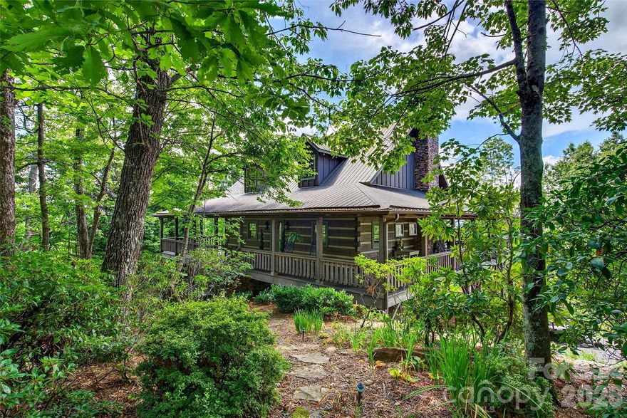Enjoy the peace and privacy of nature in this true mountain retreat, all while being just minutes from Asheville and other popular destinations. Designed to capture the beauty of its surroundings, this home features a stunning wraparound porch, large and spacious sunroom, and screened-in porch—perfect for taking in panoramic views of Lake Lure nestled in the valley below, with mountains rising on every side. This well-maintained home showcases quality construction throughout. Please note you get an additional 1.52 acre lot making the total acreage over 4 acres. This lot can be a privacy buffer or investment lot to sell later.

Built to highlight the breathtaking scenery, the home offers convenient main-level living with layered mountain views. The light-filled kitchen features ample cabinetry, or step outside to cook on the screened-in porch while enjoying the fresh mountain air. Also on the main floor you will find the primary bedroom with an ensuite bath, a half bath with a laundry, foyer, kitchen and dining. With just opening the double doors, you can enjoy the large screened porch as well as the deck space.

Upstairs, you’ll find a loft currently used as a family room, along with a full bath and a spacious bedroom with an en suite bathroom as well as offering beautiful mountain views.

The lower level provides a warm and inviting space with an additional fireplace—perfect for entertaining or relaxing with a good book. This level also includes a large bedroom and en suite bath.

You’ll also find a garage and workshop on the lower level, offering plenty of storage and functional space.

Rustic charm blends seamlessly with modern comfort, featuring warm wood interiors, soaring ceilings, and thoughtful craftsmanship throughout, including impressive handcrafted floor-to-ceiling fireplaces. Most furnishings are negotiable, offering the option for a turn-key purchase.

Ideal as a full-time residence, second home, or investment property, short-term rentals are allowed—making this an excellent opportunity. Conveniently located just minutes from Interstate 40 and close to the area’s most sought-after destinations.

Gateway Mountain offers exceptional natural amenities, including Lake George, Waterfall Park, and Picnic Lake just down the road(please note these areas are closed to the public).

If owning a mountain home in Western North Carolina has been on your mind, this one-of-a-kind property is not to be missed. Visit www.gmpoa.org to learn about the community or schedule your own private tour today.