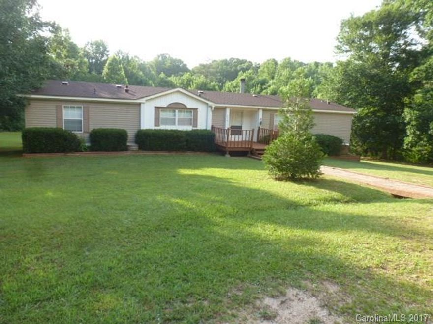 Peace and Quiet on 16.94 acres in the Buford community, has creek/stream, so peaceful. Doublewide mobilehome with 3BR's, 2BA's, has 1960 sq ft, kitchen with all appliances, fml living room, greatroom with fireplace and gas logs. Have yourself a garden, bring your horses, ride your 4 wheelers. Make this yours today!