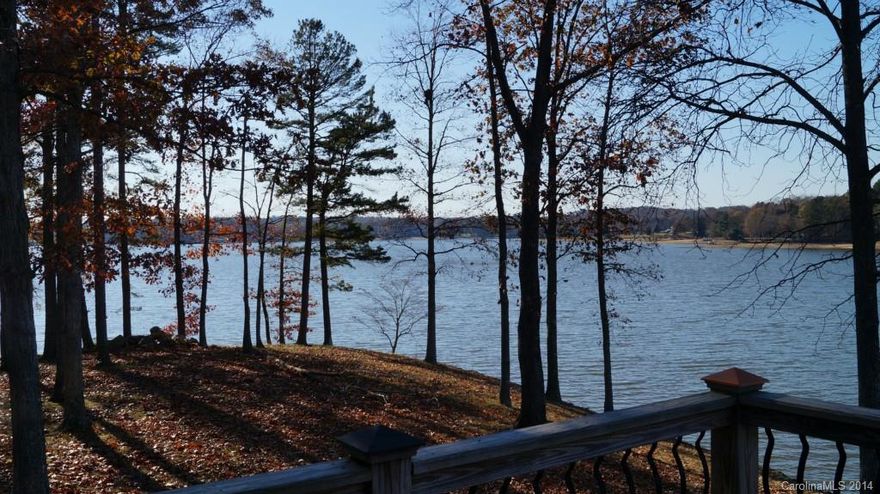 Absolutely gorgeous waterfront home with great waterfront views from every room. Sunroom overlooking 400+/- ft of shoreline, private deck off master with great views. Hardwood floors through out the home, fireplace, open living room, stainless stain appliances included as well as the washer and dryer if needed.  OWNER IS BUILDING A PIER IN 2015!!